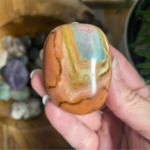 Polychrome Jasper multi color polished crystal palm stone.